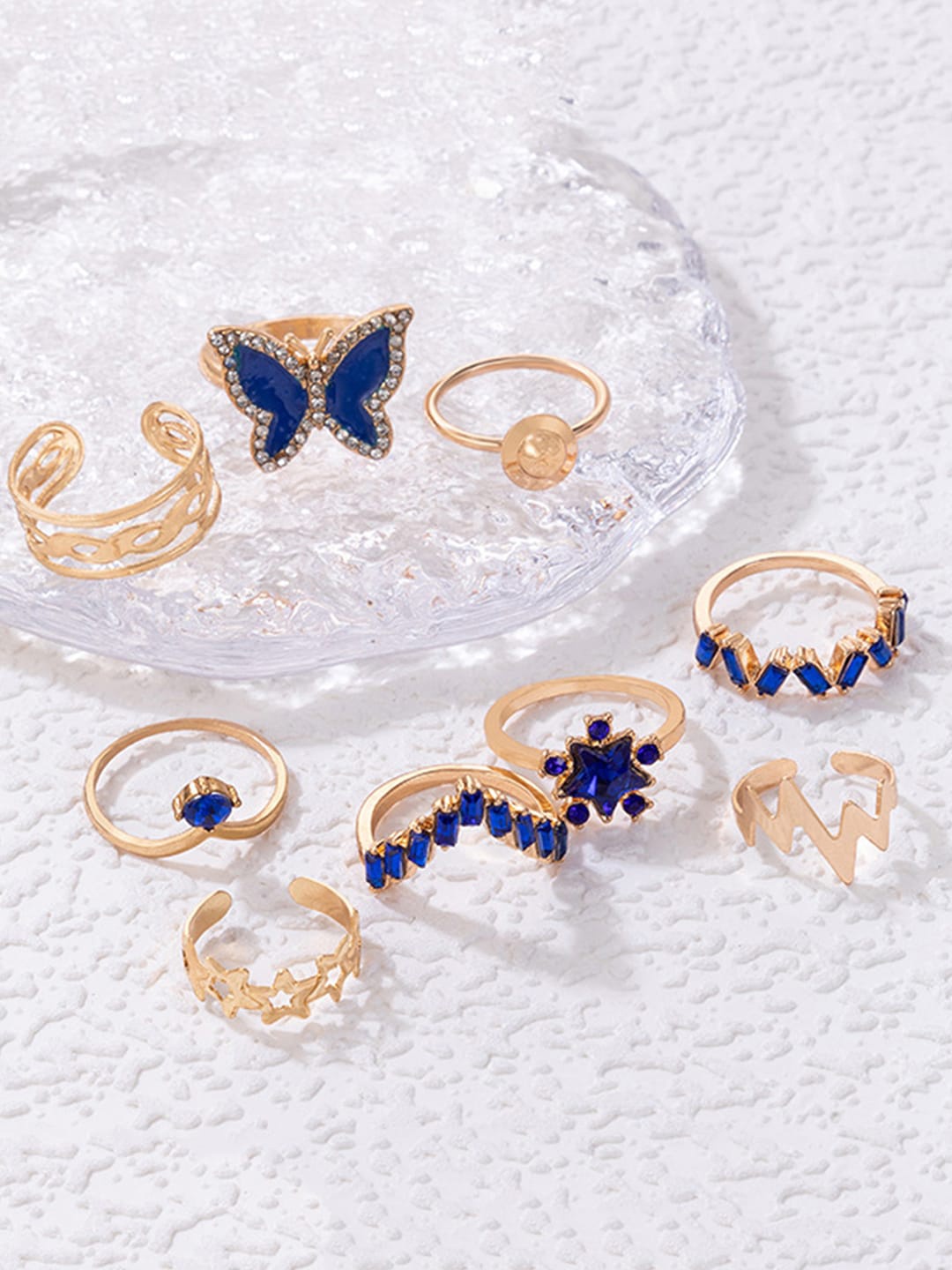 

Scintillare By Sukkhi Set Of 9 Gold-Plated Stone-Studded Finger Rings Blue Ring
