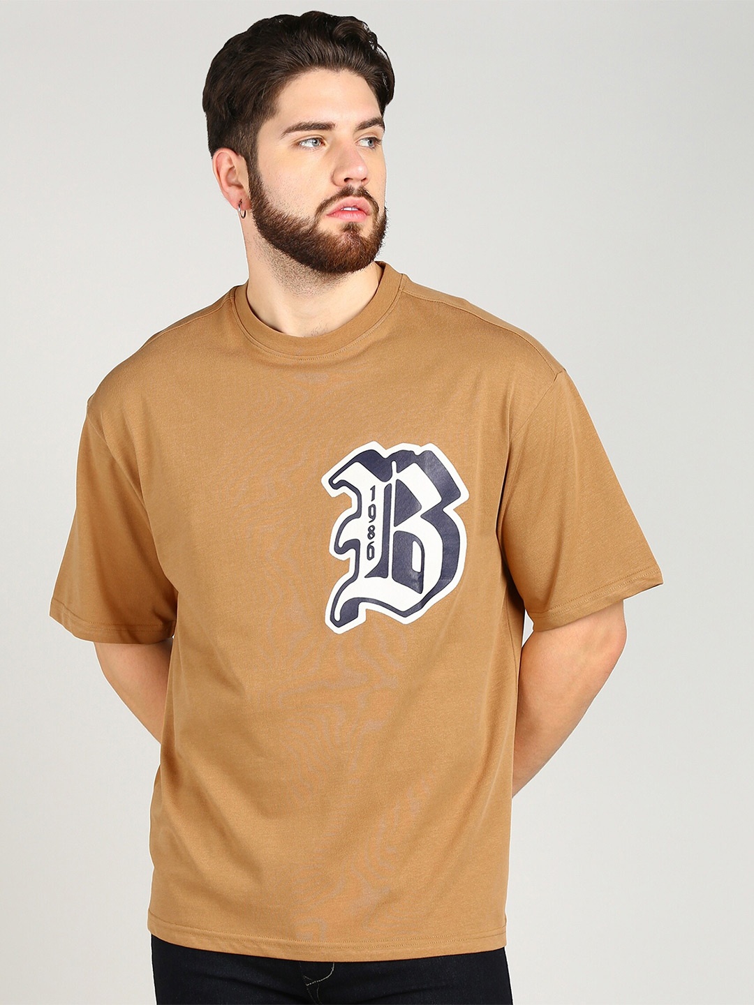 

Alan Jones Typography Printed Pure Cotton Oversized T-shirt, Beige