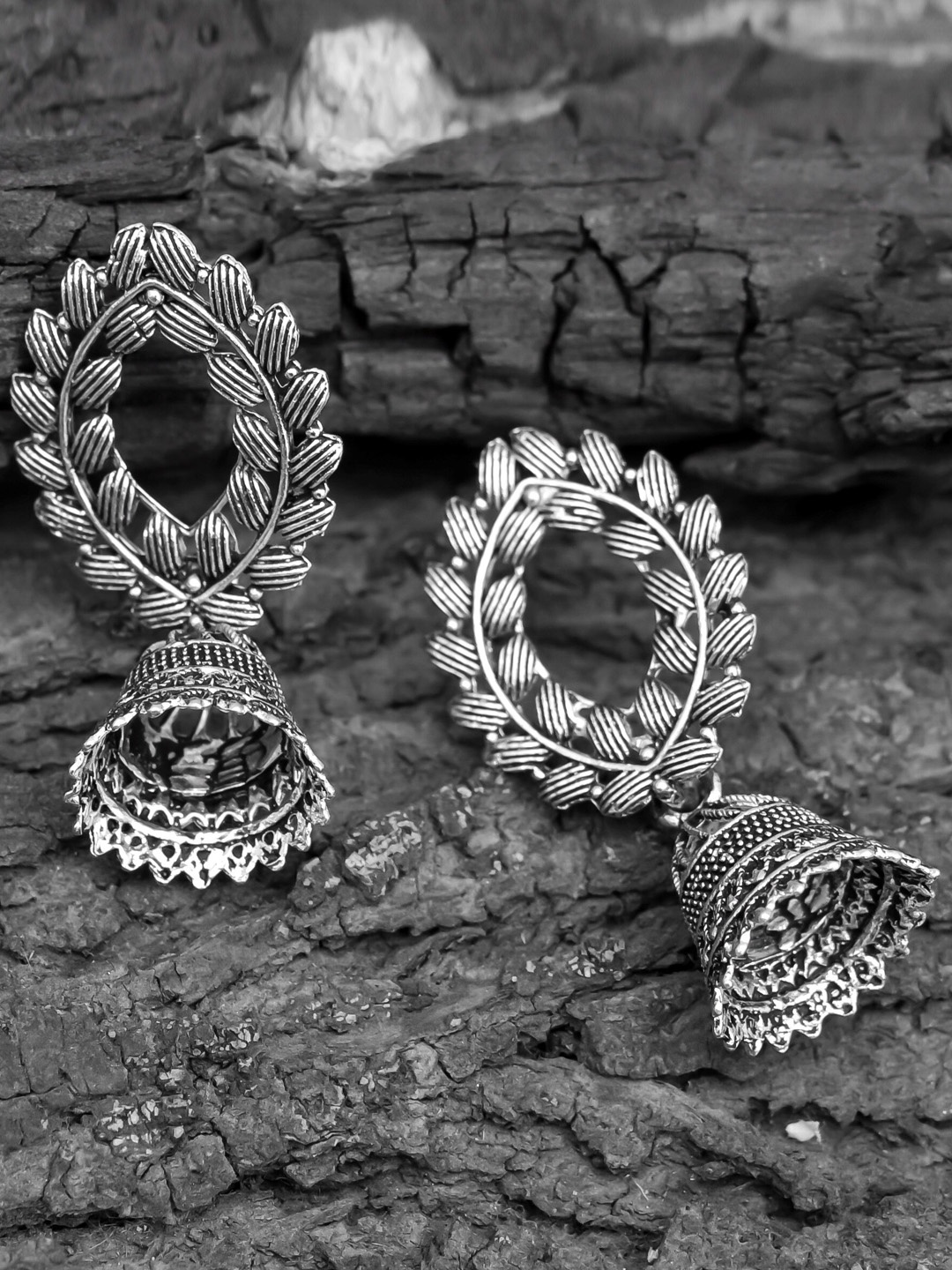 

ROHINIKA Silver-Plated Leaf Design Oxidized Oval Jhumkas