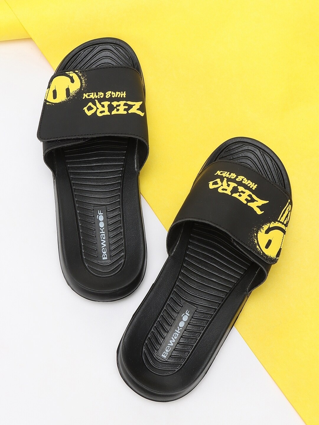 

Bewakoof Men Black & Yellow Printed Smiley Comfysole Sliders