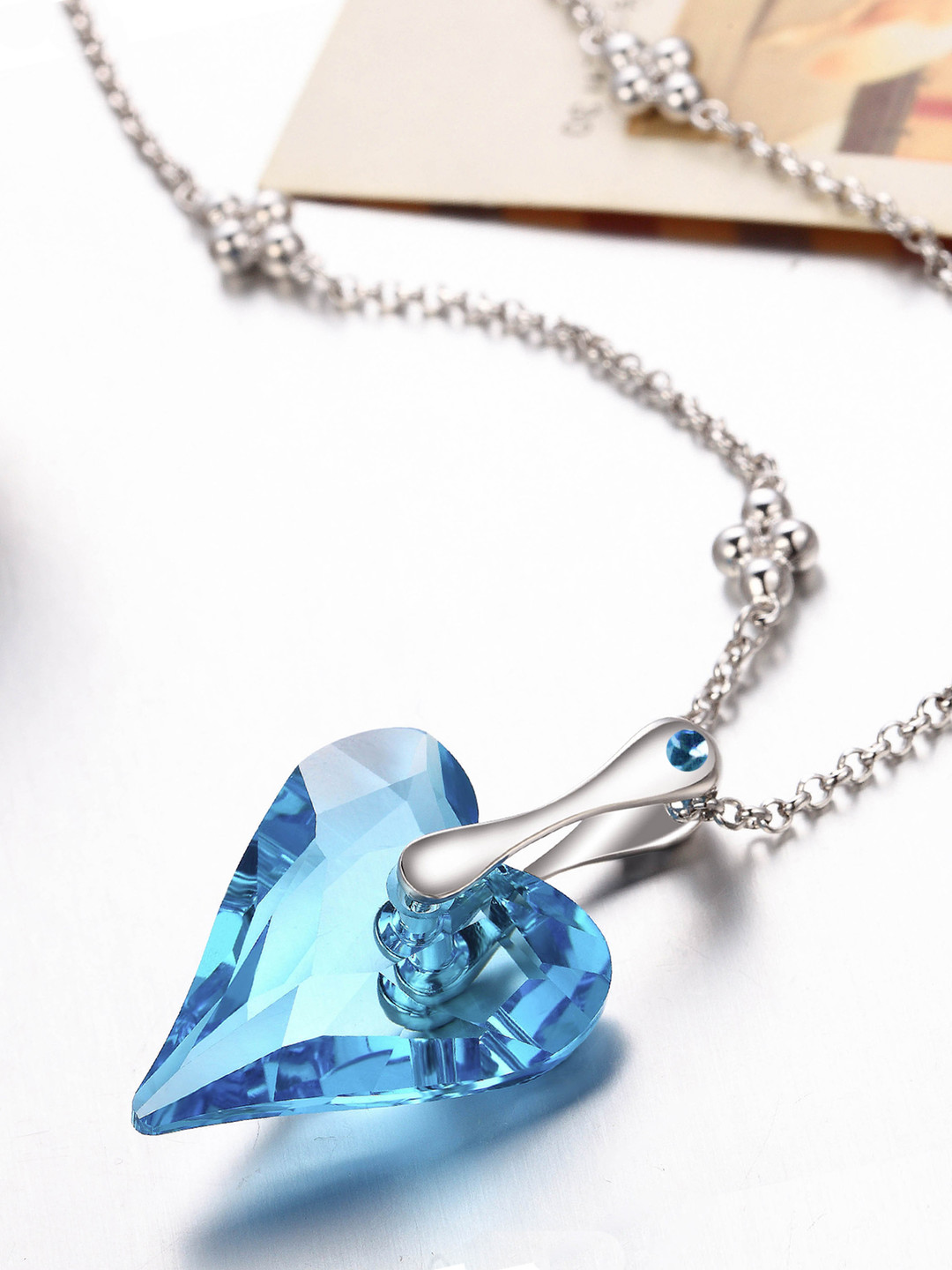 

Yellow Chimes Crystals from Swarovski Collection Silver-Toned & Blue Heart-Shaped Pendant with Chain