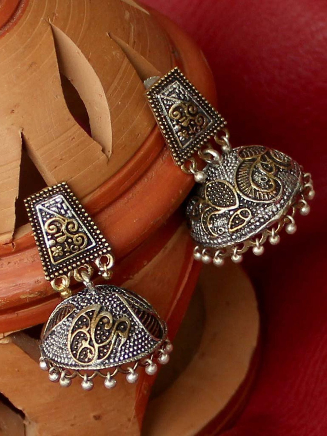 

Priyaasi Antique Gold-Toned Oxidised Silver-Plated Peacock Shaped Jhumkas