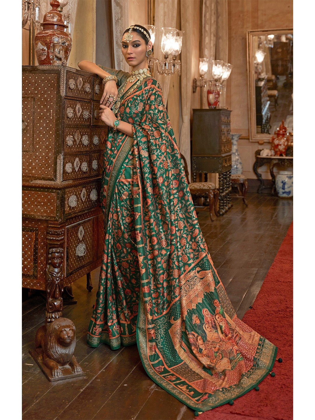 

Mitera Green & Orange Floral Printed Beads and Stones Patola Saree