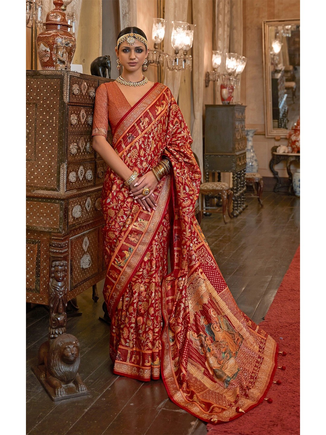 

Mitera Red & Green Floral Printed Beads and Stones Patola Saree