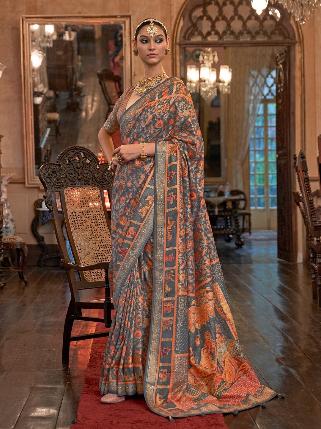 

Mitera Grey & Orange Floral Printed Beads and Stones Patola Saree