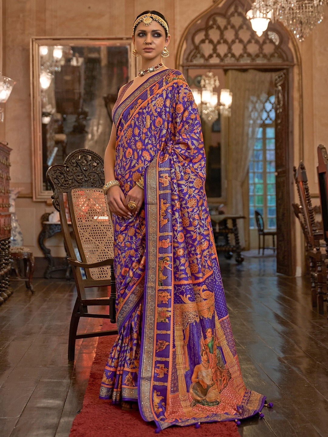 

Mitera Purple & Orange Floral Printed Beads and Stones Patola Saree