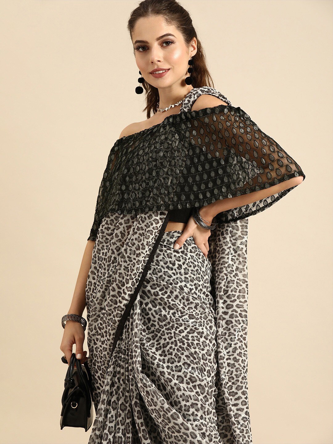 

Sangria Black & Beige Leopard Print Pure Georgette Saree