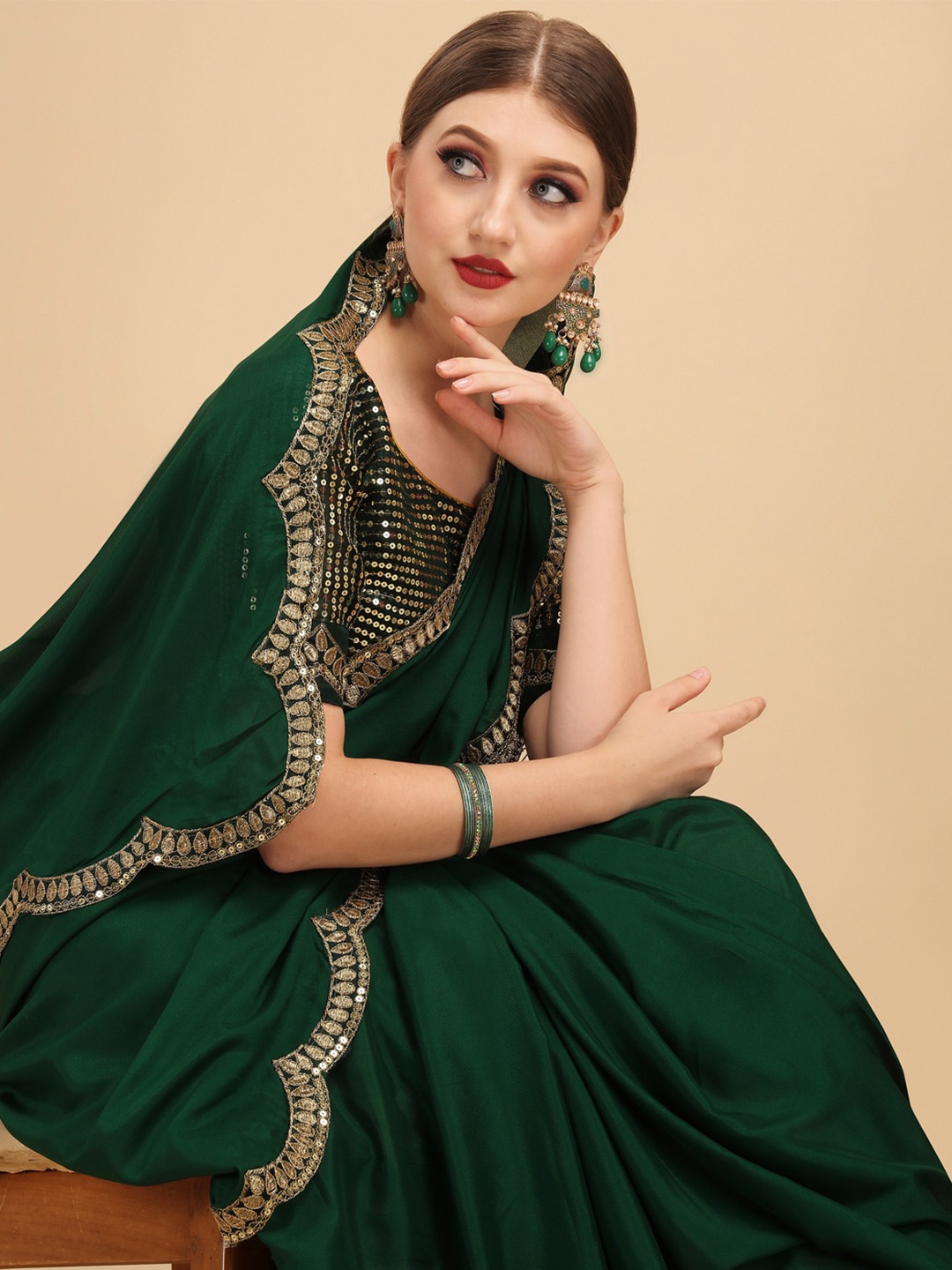 

Sangria Green Embroidered Border Sequinned Detail Pure Crepe Designer Saree