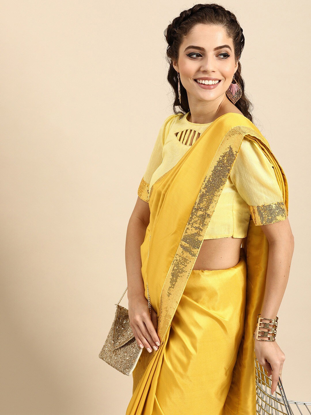 

Sangria Mustard Yellow Embellished Border Saree