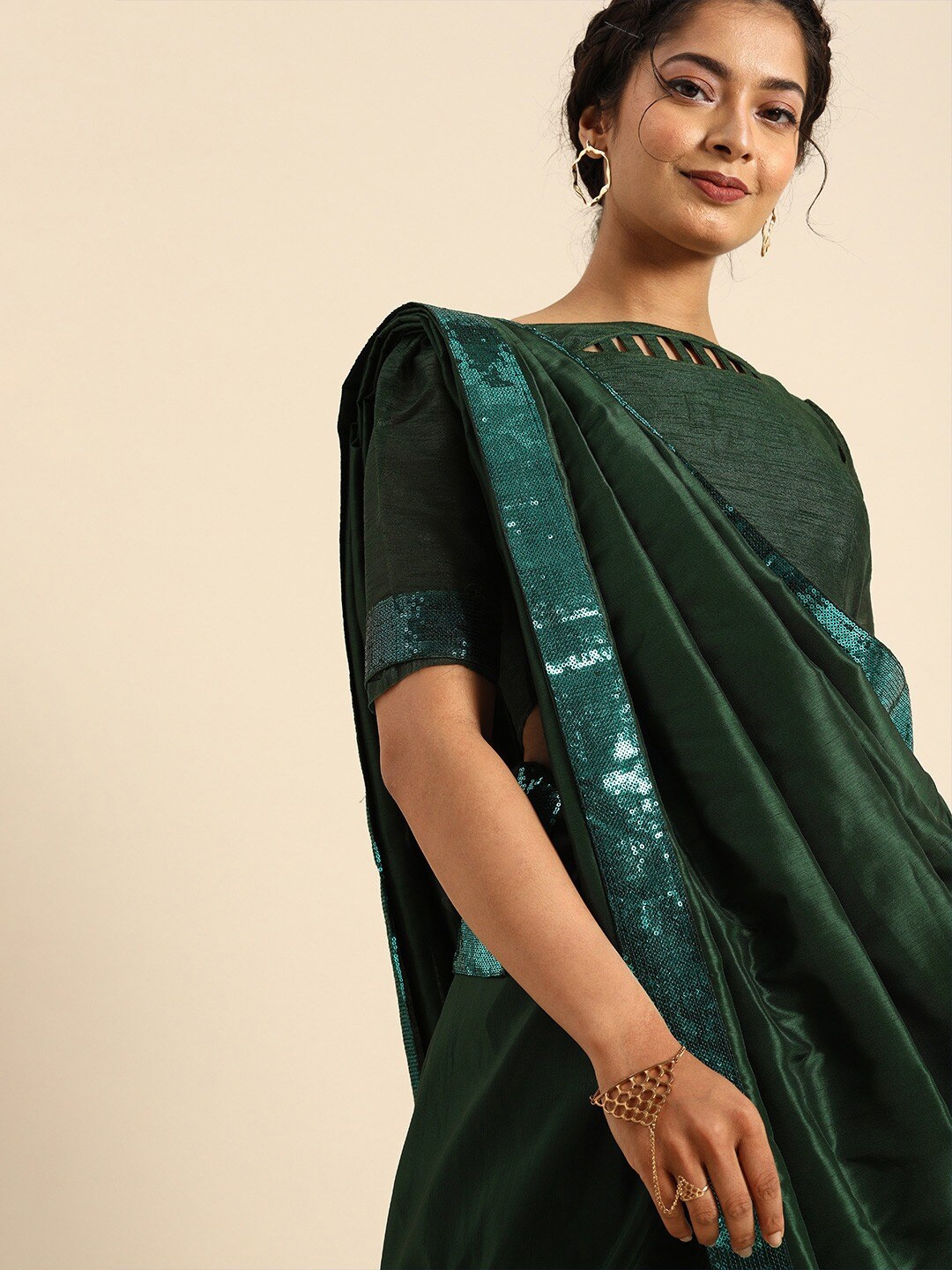 

Sangria Green Sequinned Border Saree