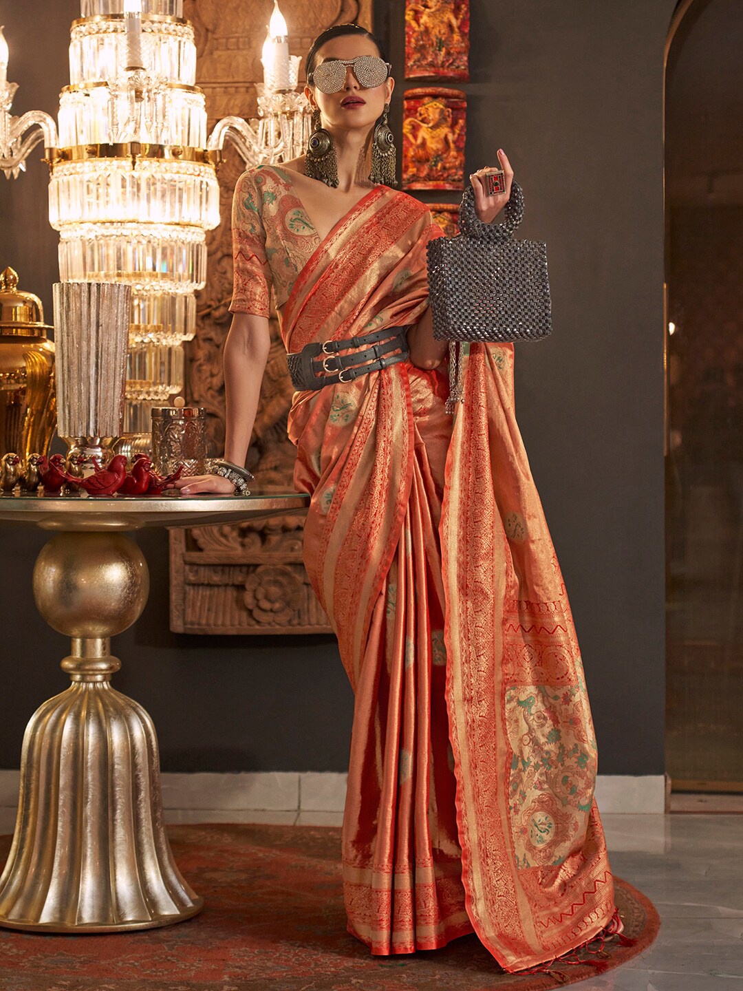 

Mitera Orange & Gold-Toned Ethnic Motif Woven Design Zari Banarasi Saree