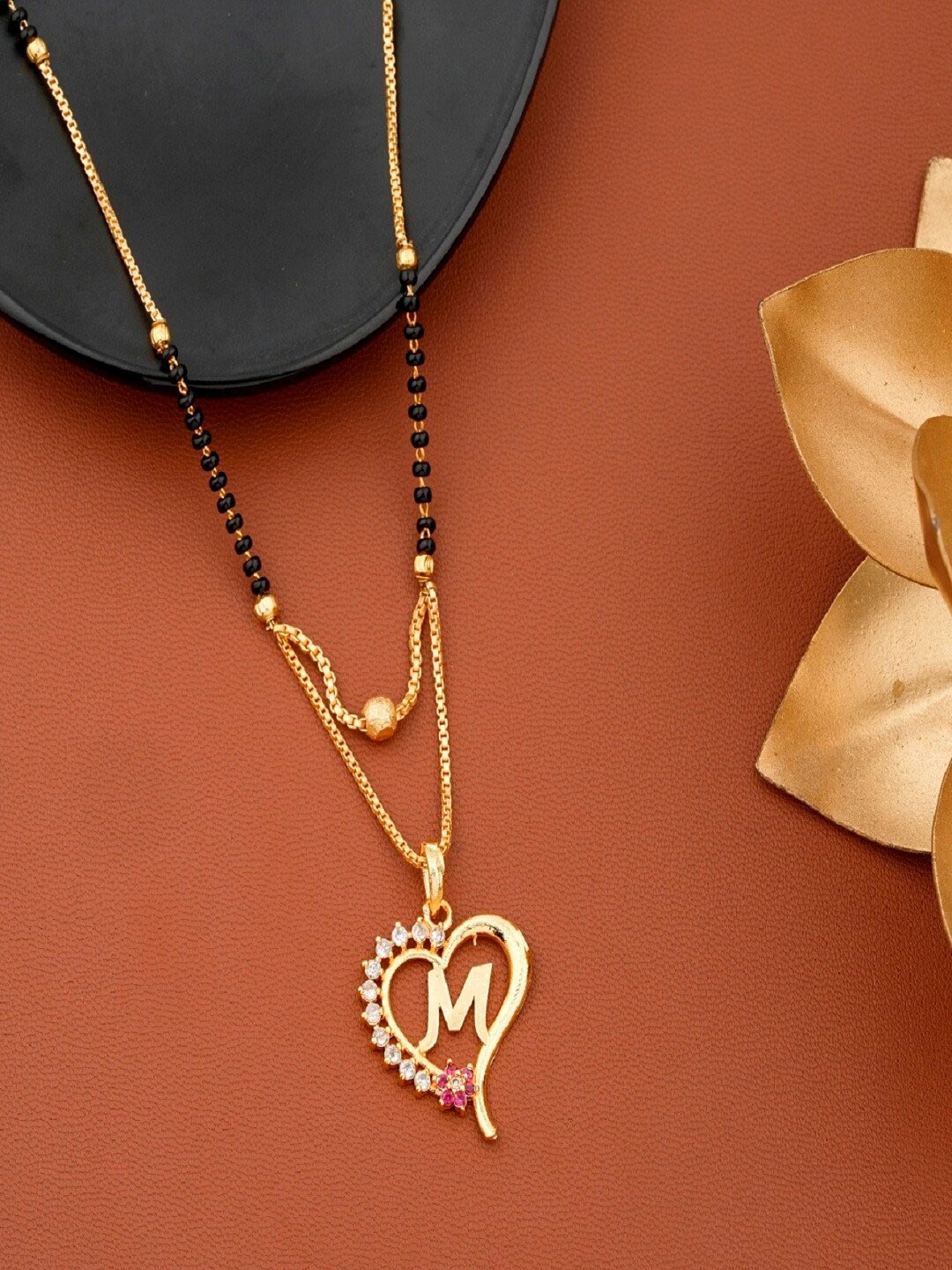 

JEWEL WORLD Gold-Plated Stone-Studded & Beaded Initial M Shaped Mangalsutra