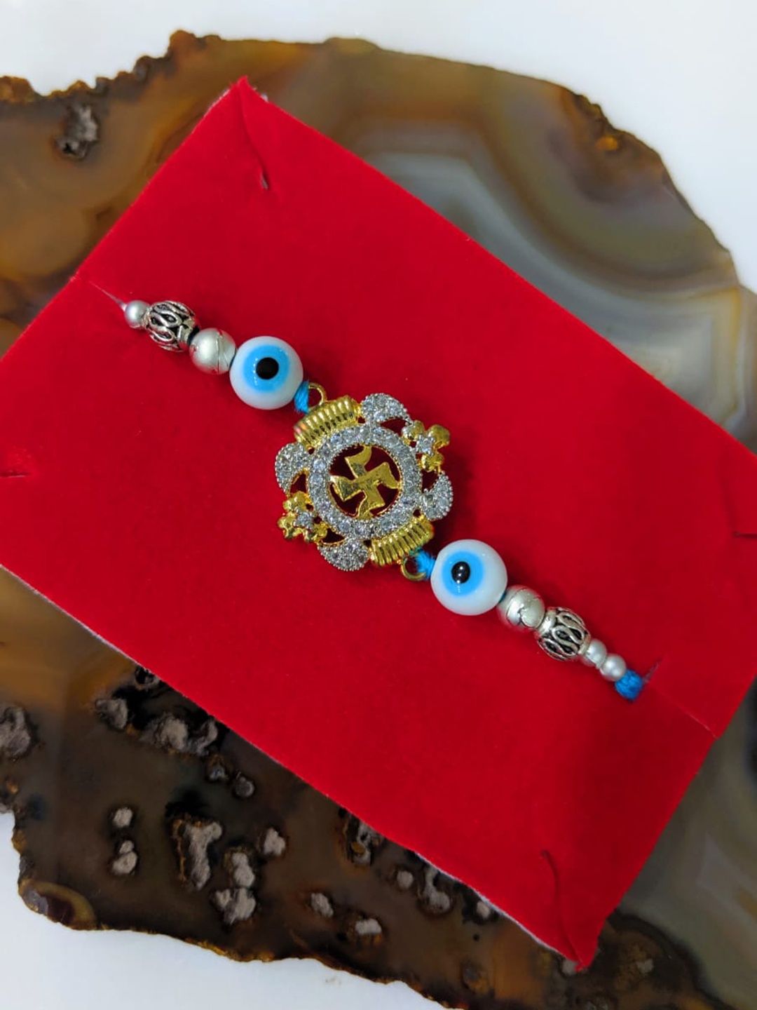 

Digital Dress Room Blue Evil Eye & Swastik Beads Rakhi, Gold