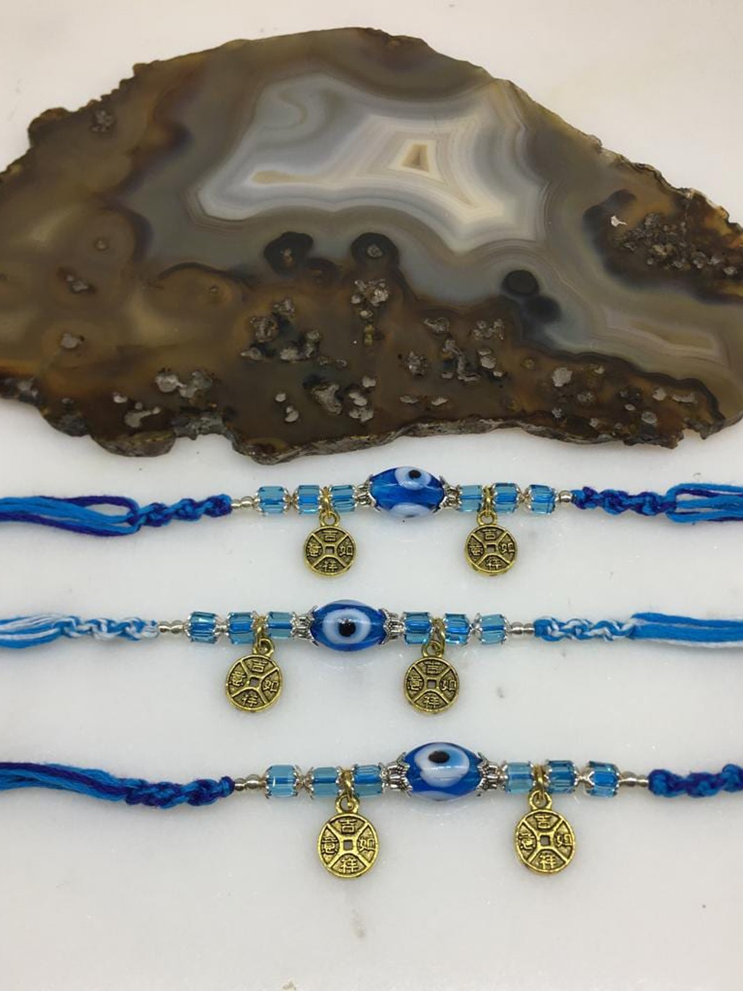 

Digital Dress Room Set Of 3 Gold-Plated Evil Eye Rakhi, Blue