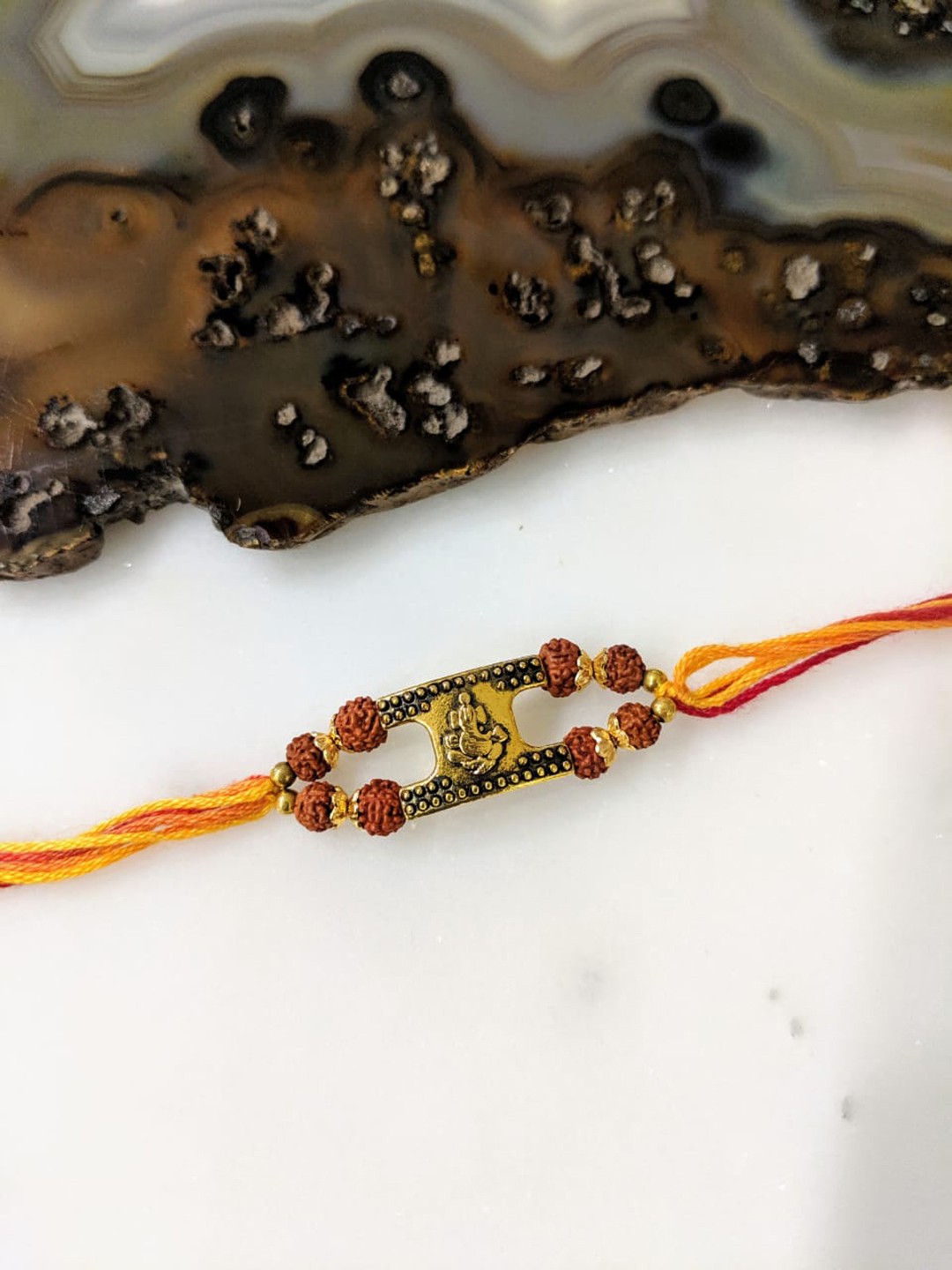 

Digital Dress Room Gold-Plated Ganesh Ji Rudraksha Wrist Thread Band