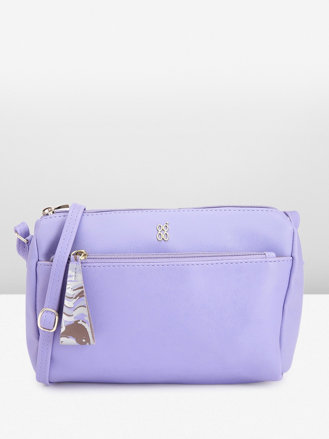 

Baggit Solid PU Structured Sling Bag with Tasselled Detail, Lavender