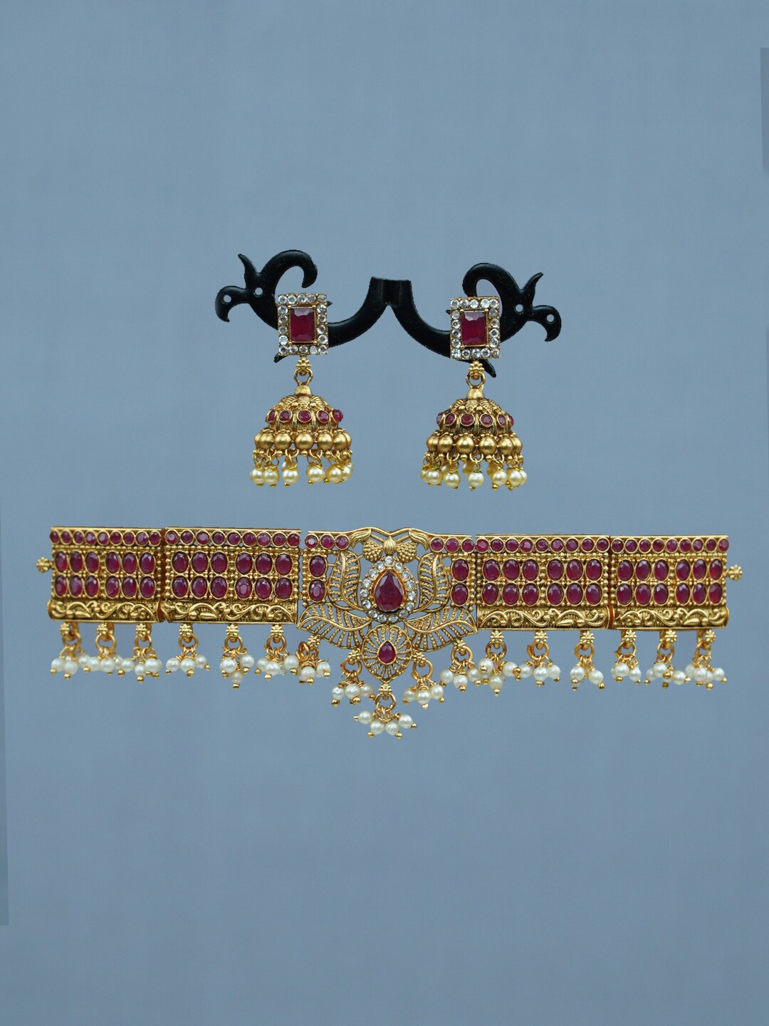 

Diksha collection Gold-Plated Stone Studded & Beaded Necklace & Earrings