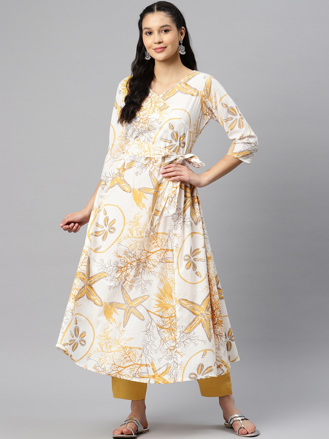 

Readiprint Fashions Women Floral Printed Regular Sequinned Pure Cotton Kurta with Palazzos, Mustard