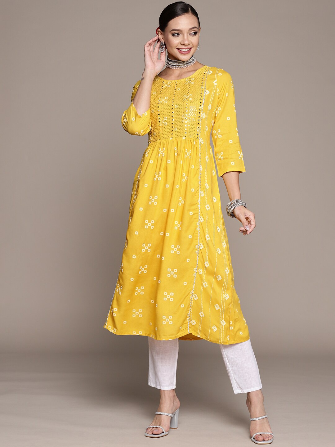 

Anubhutee Bandhani Printed Sequined Mirror & Thread Work Gotta Patti A-Line Kurta, Yellow