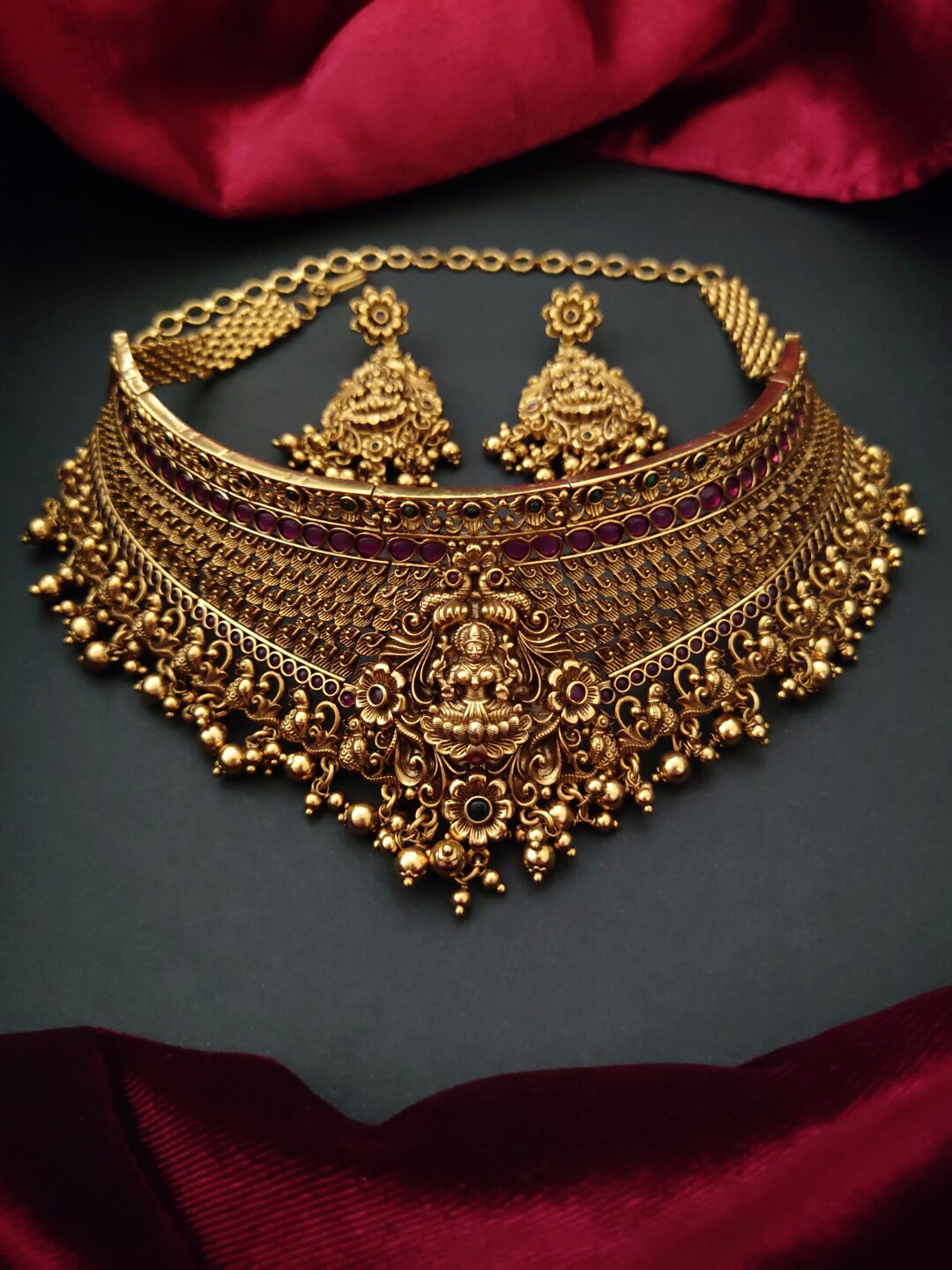 

Pihtara Jewels Gold-Plated Stone Studded Antique Temple Choker Jewellery Set