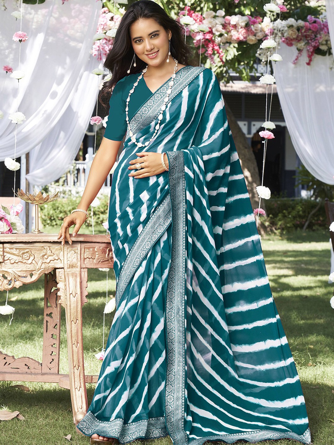 

Satrani Teal & White Leheriya Striped Zari Poly Georgette Saree