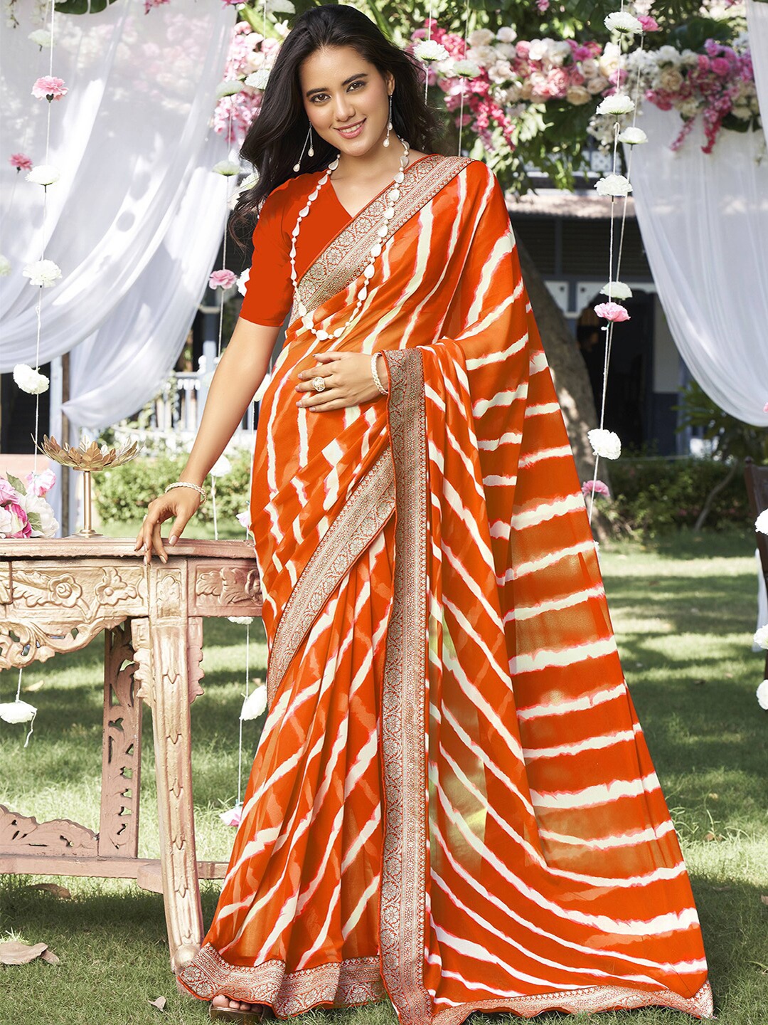 

Satrani Orange & White Striped Saree