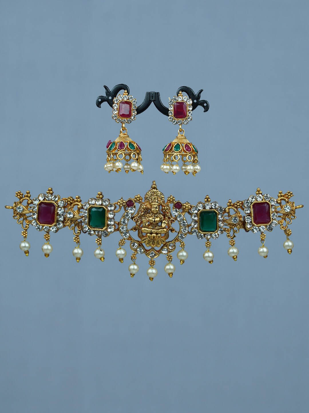 

Diksha collection Gold-Plated Stone Studded & Beaded Temple Jewellery Set