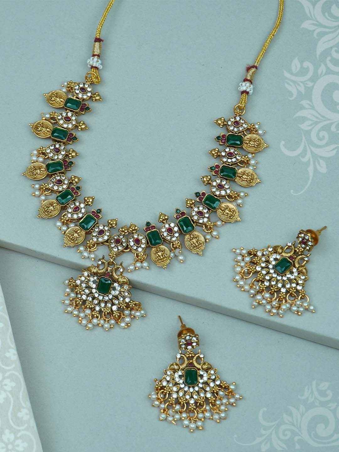 

Diksha collection Gold-Plated Stone Studded & Beaded Jewellery Set