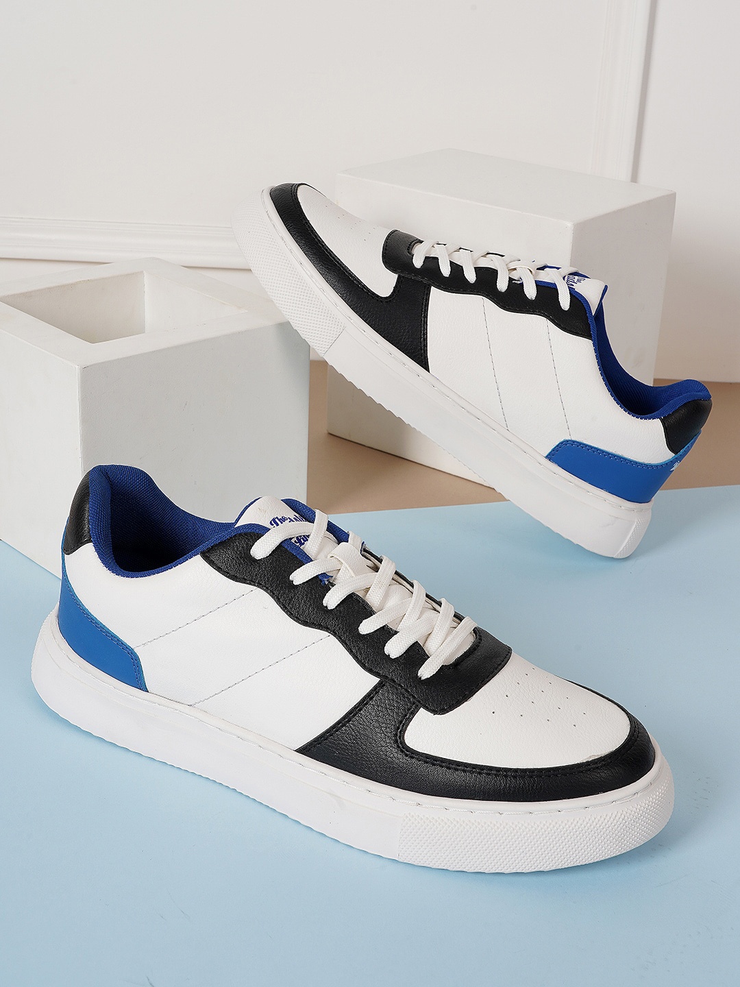 

The Roadster Lifestyle Co. Men White And Black Colourblocked Custom Orthotics Sneakers