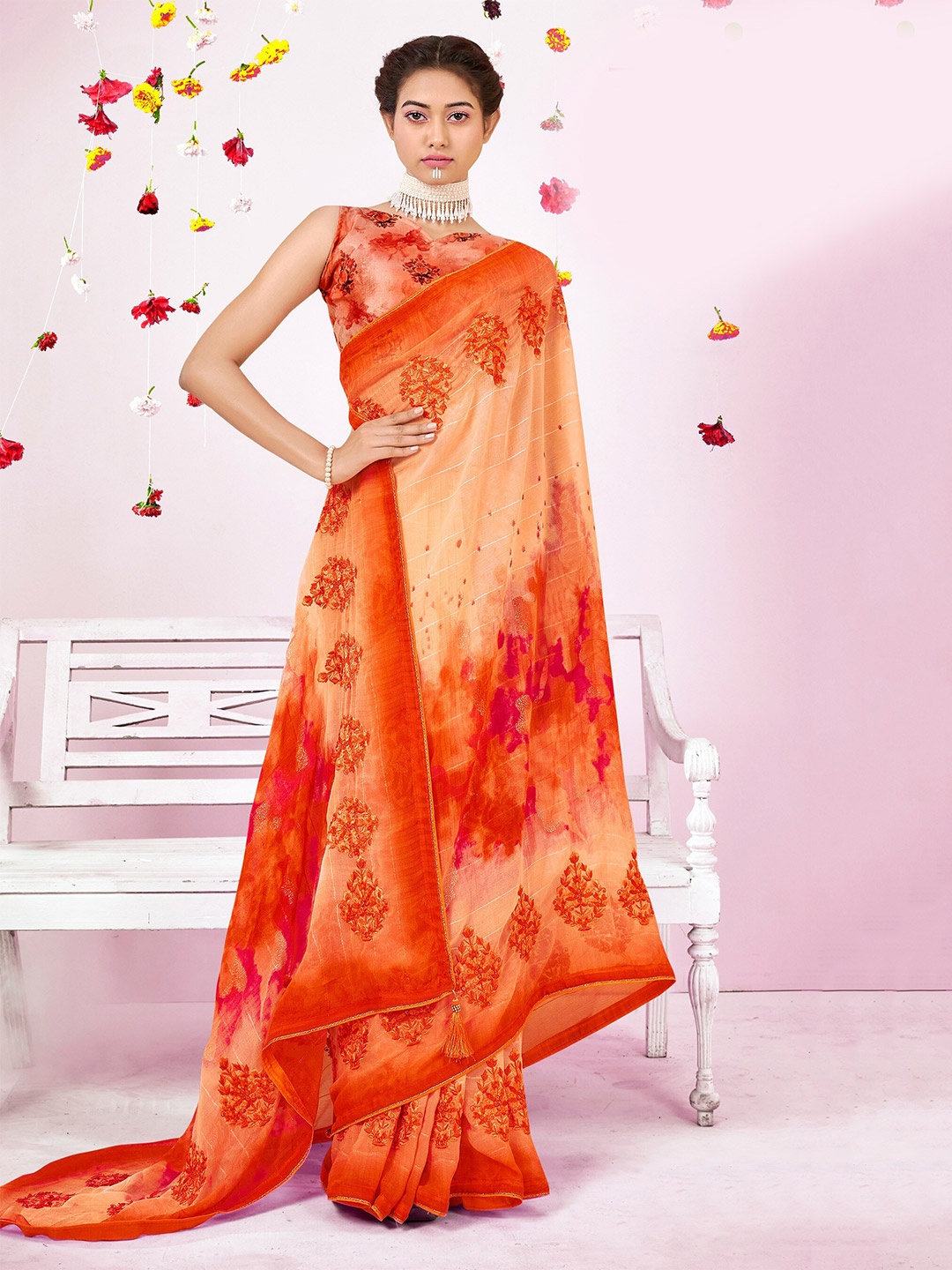 

Triveni Orange Floral Embroidered Pure Georgette Saree