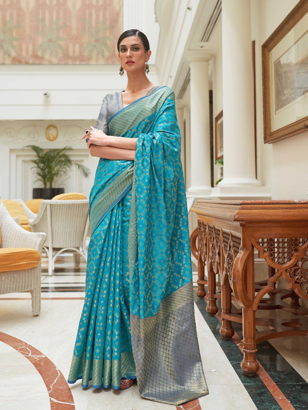 

Mitera Blue & Grey Floral Woven Design Zari Patola Saree