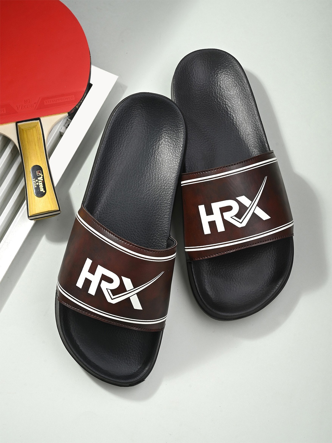 

HRX by Hrithik Roshan Men Coffee Brown & Black Brand Logo Printed Sliders