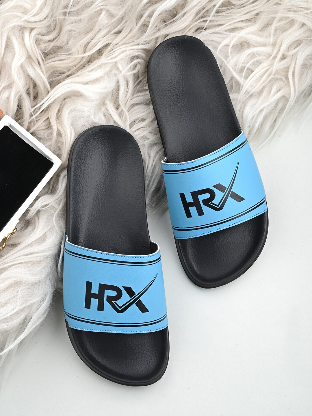

HRX by Hrithik Roshan Men Blue & Black Brand Logo Printed Sliders