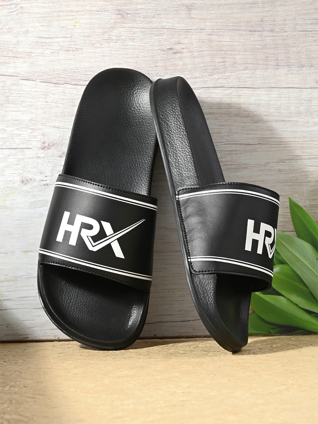 

HRX by Hrithik Roshan Men Black And White Printed Sliders