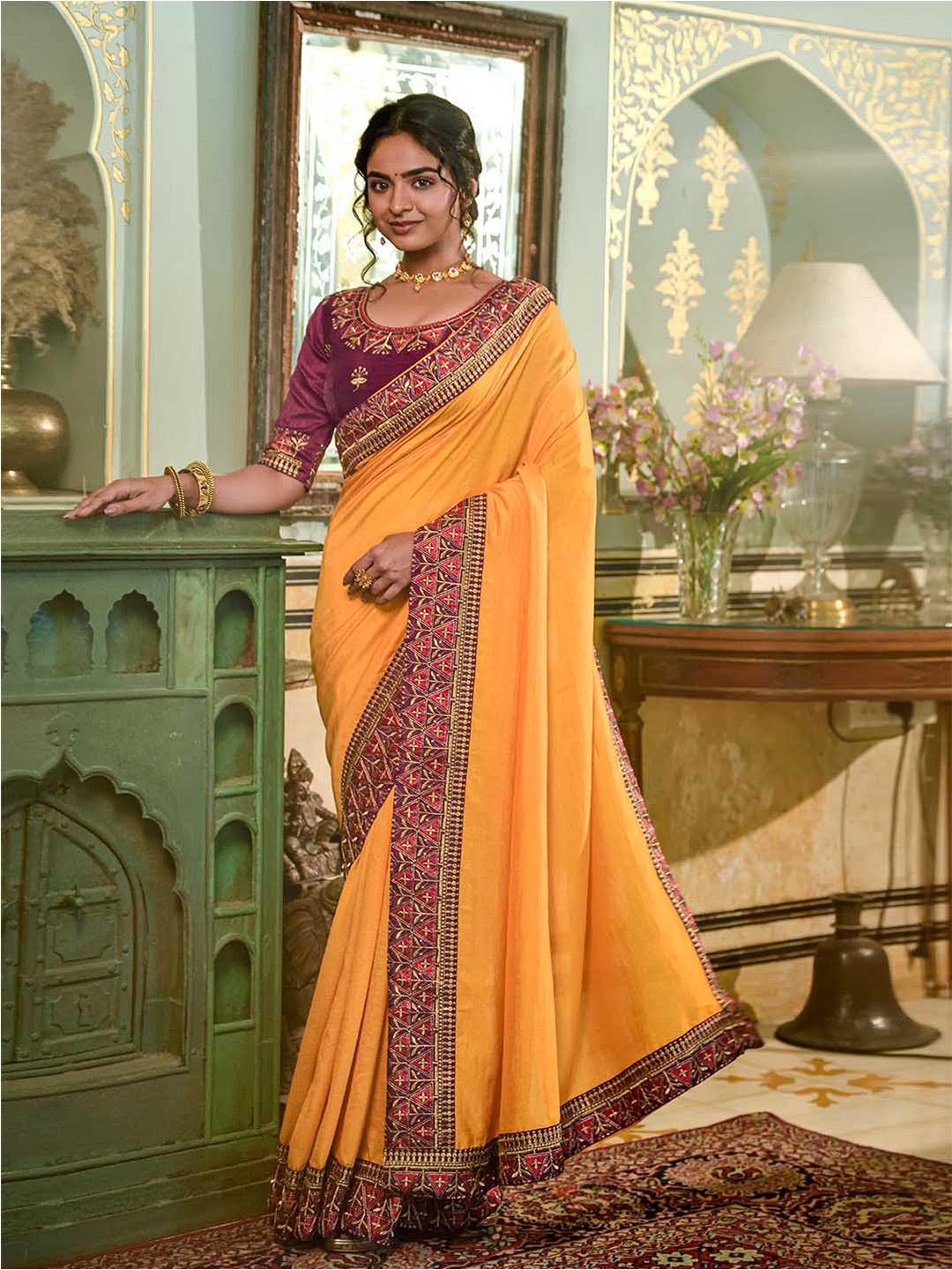 

Mitera Yellow & Pink Embroidered Zari Saree