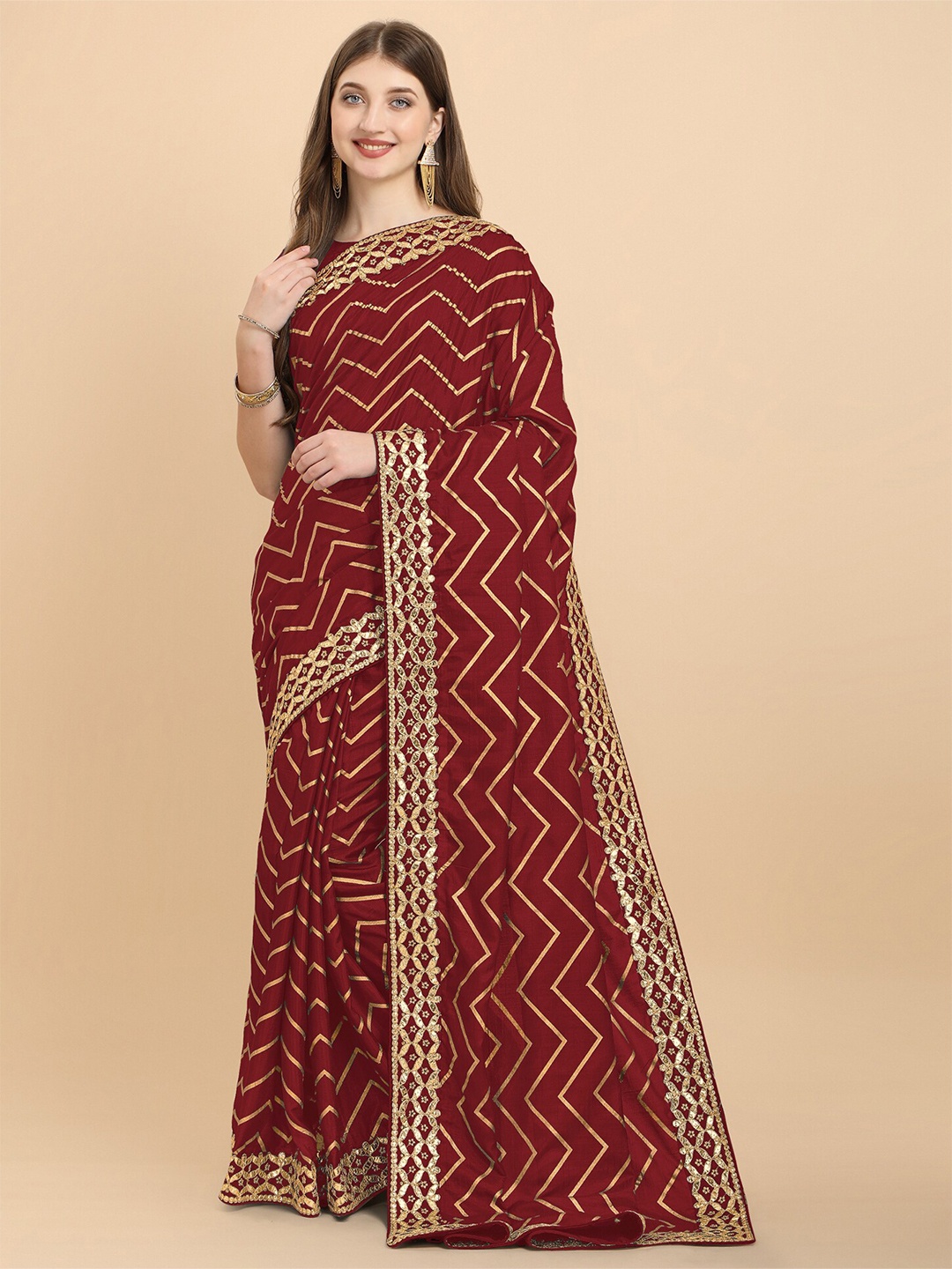 

Mitera Maroon & Gold-Toned Chevron Printed Gotta Patti Silk Cotton Leheriya Saree