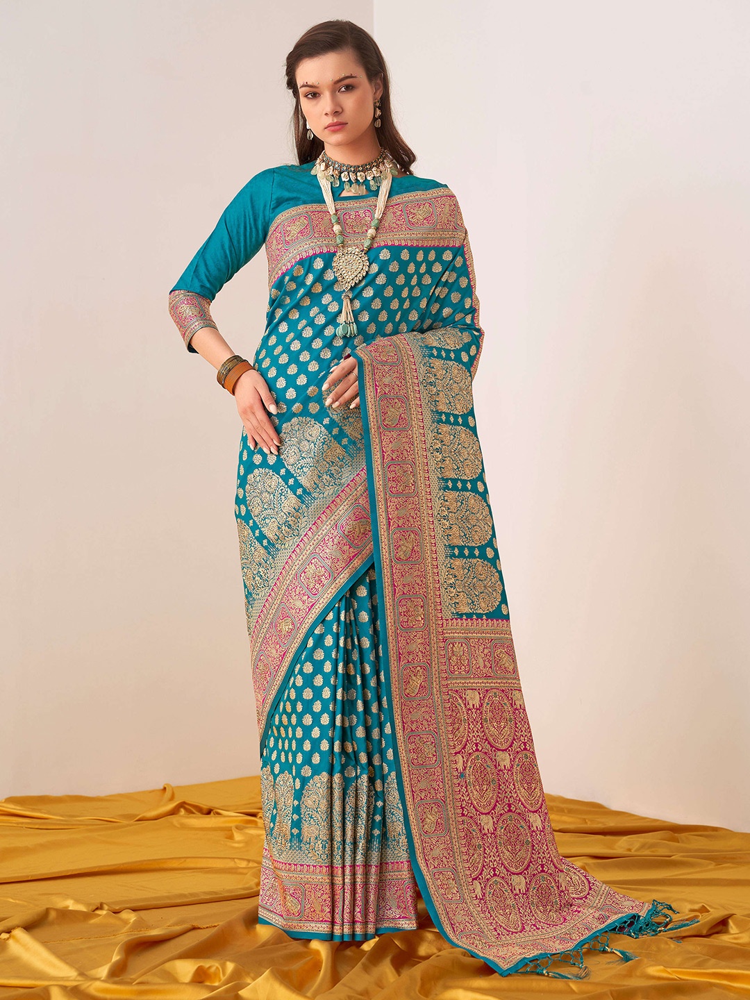 

Mitera Sea Green & Pink Ethinic Motif Woven Design Zari Saree