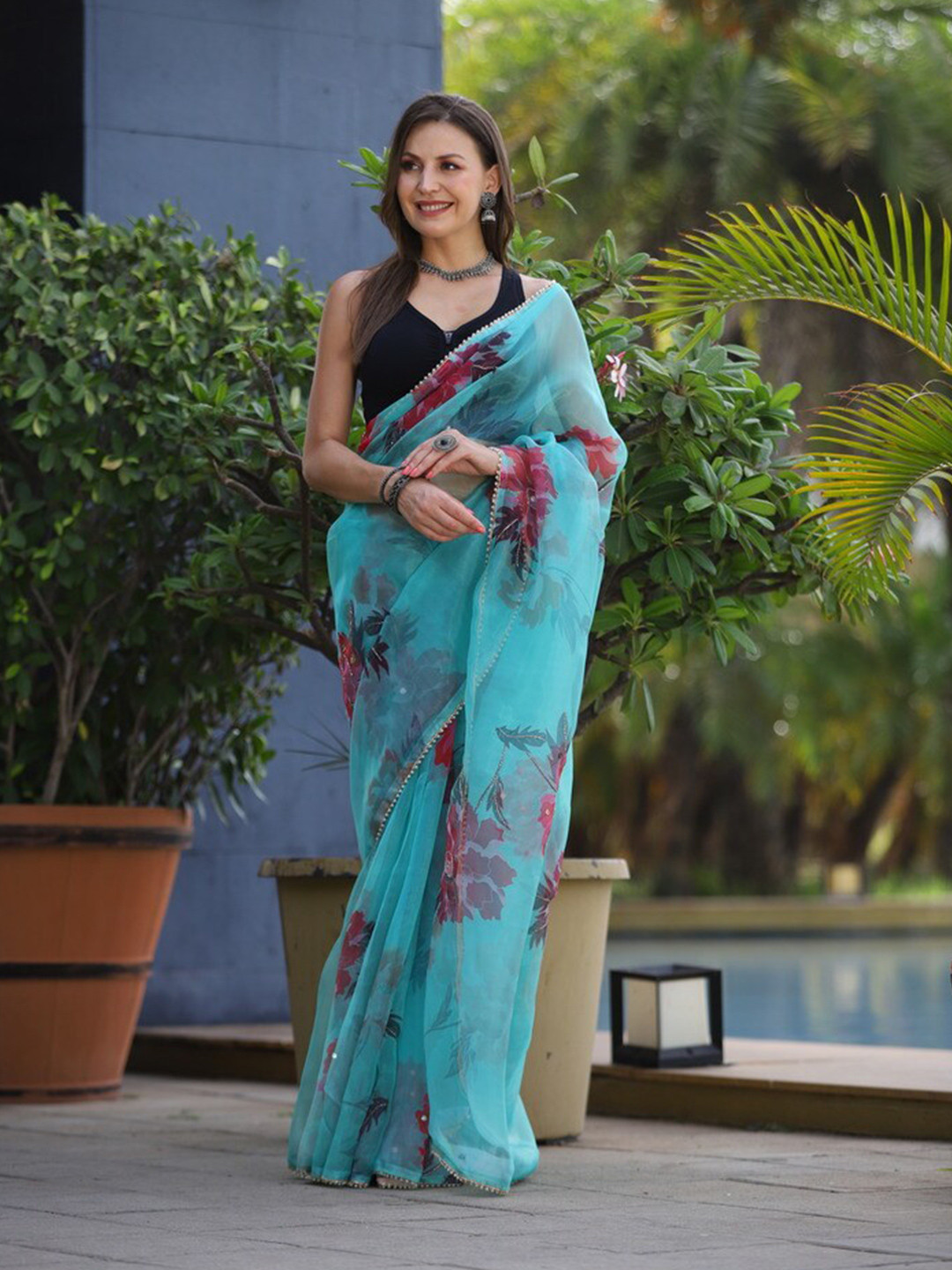 

Atulyam Tex World Floral Printed Embellished Organza Saree, Turquoise blue
