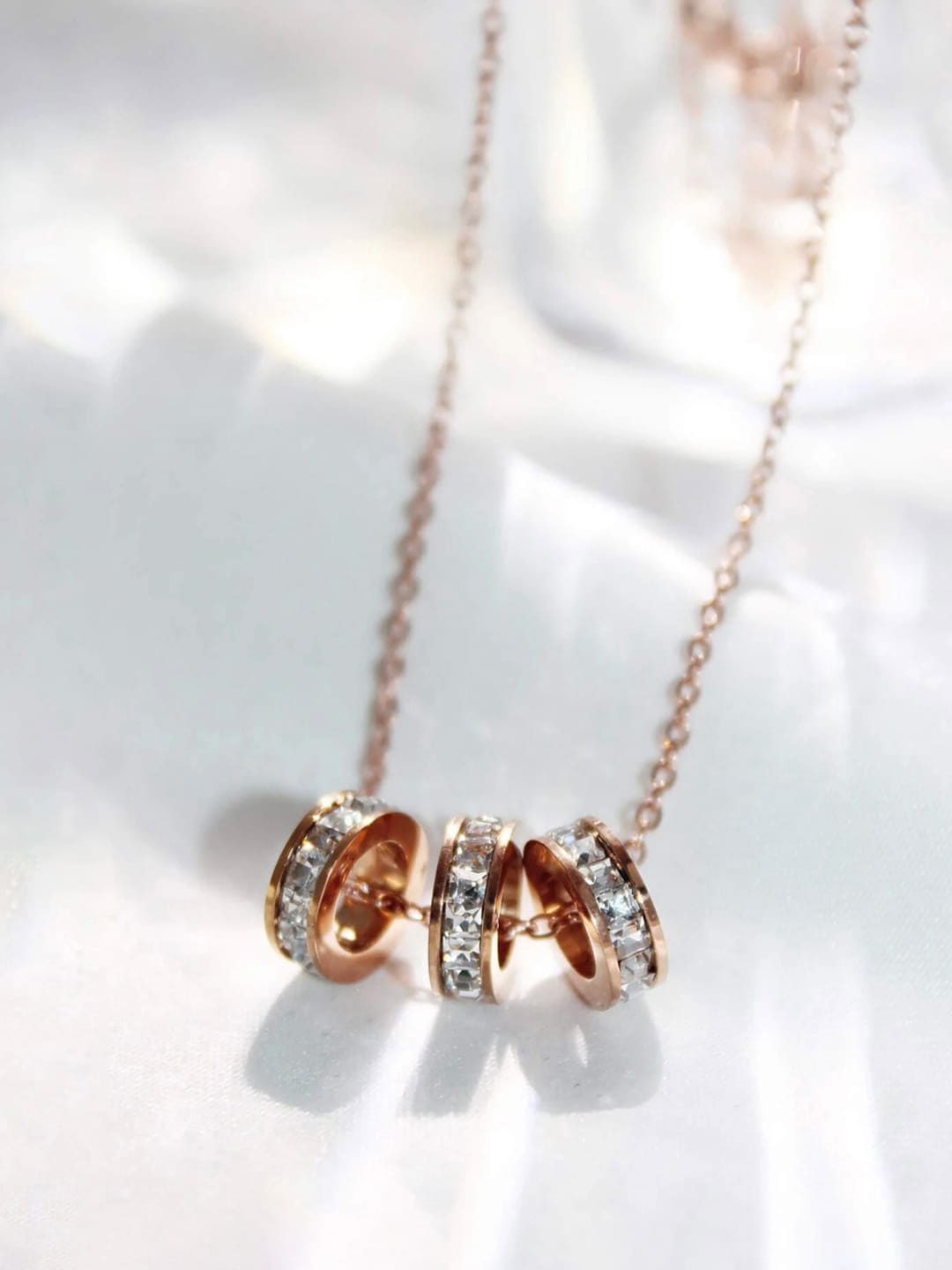 

Jewels Galaxy Rose Gold-Plated Cubic Zirconia Cylindrical 3 Loop Pendant With Chain