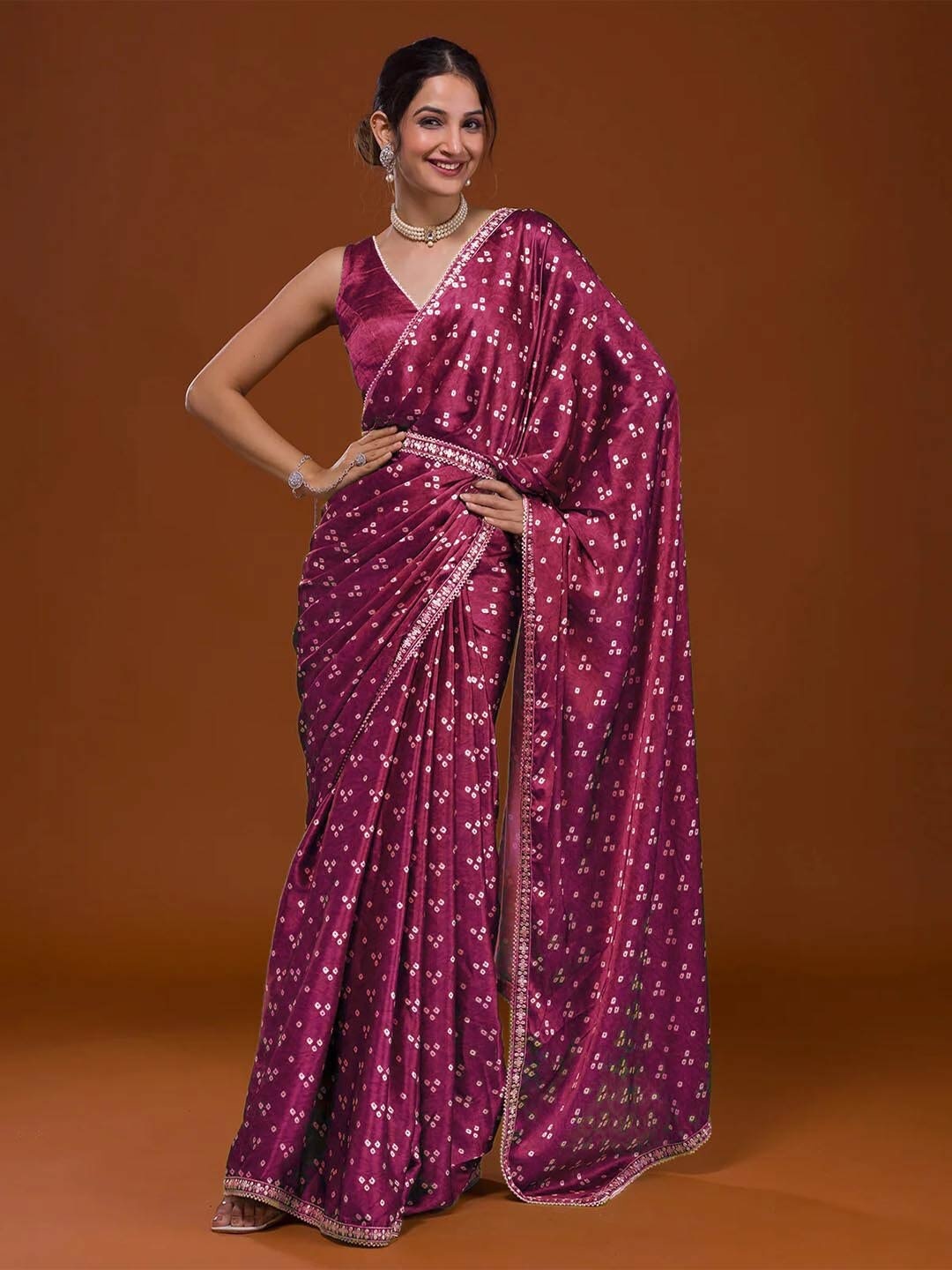 

Mitera Pink & White Bandhani Embroidered Saree