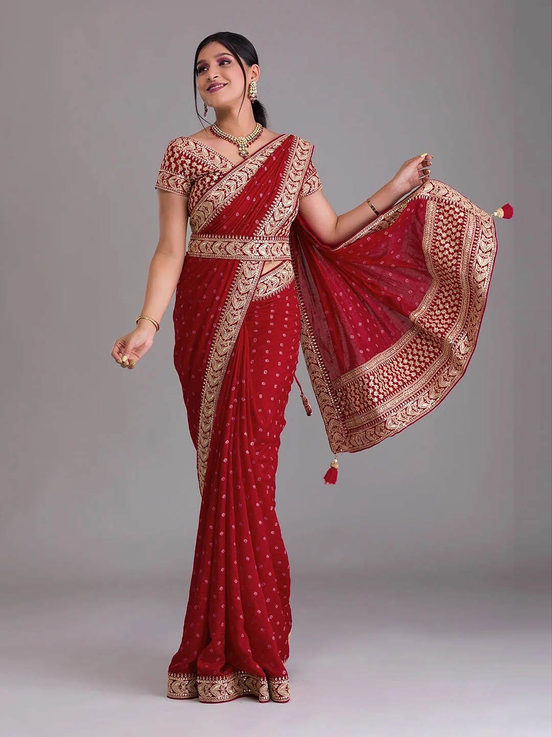 

Mitera Red & Pink Bandhani Printed Poly Chiffon Saree