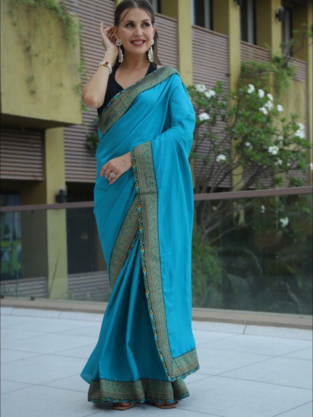 

Atulyam Tex World Zari Poly Georgette Saree, Blue