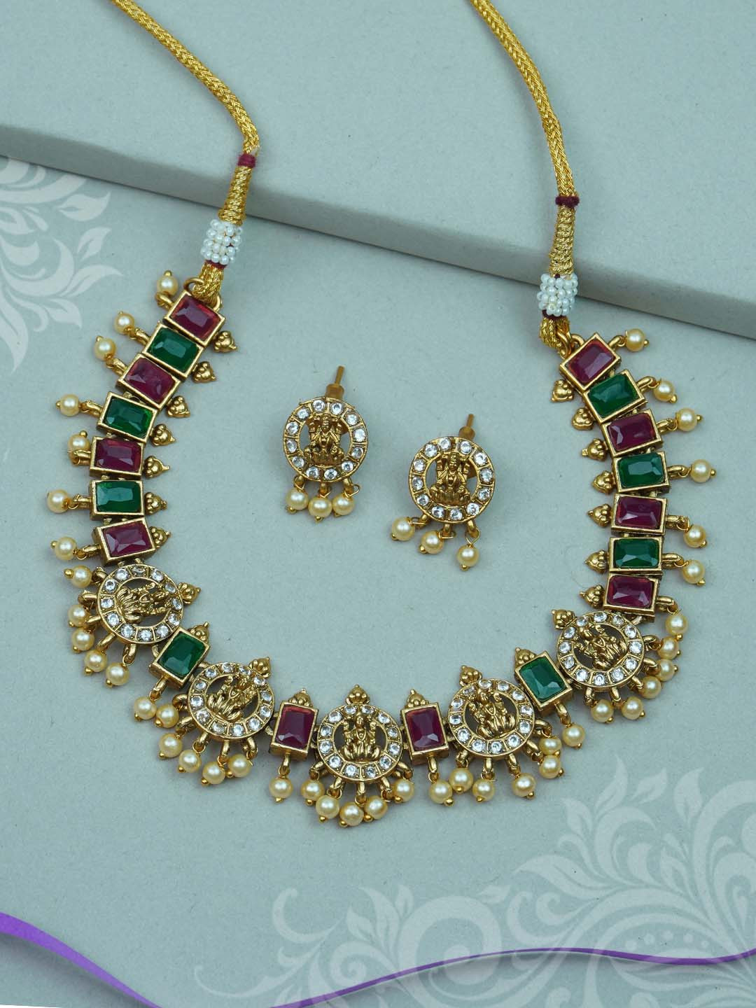 

Diksha collection Gold-Plated Stone-Studded & Beaded Jewellery Set
