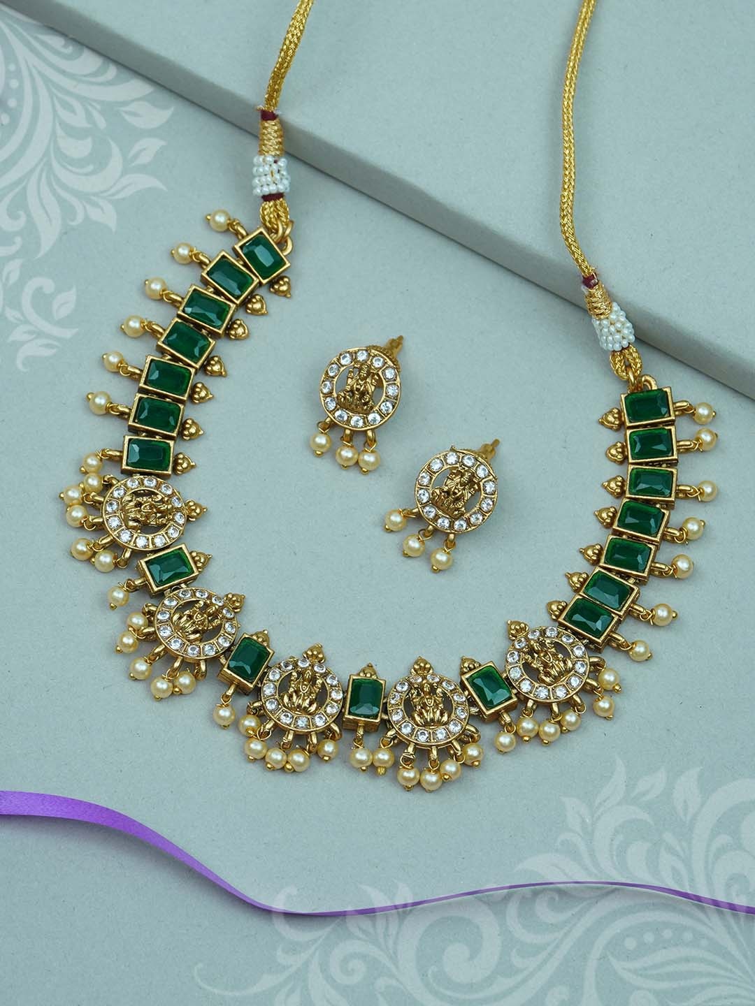 

Diksha collection Gold-Plated Stone-Studded & Beaded Jewellery Set