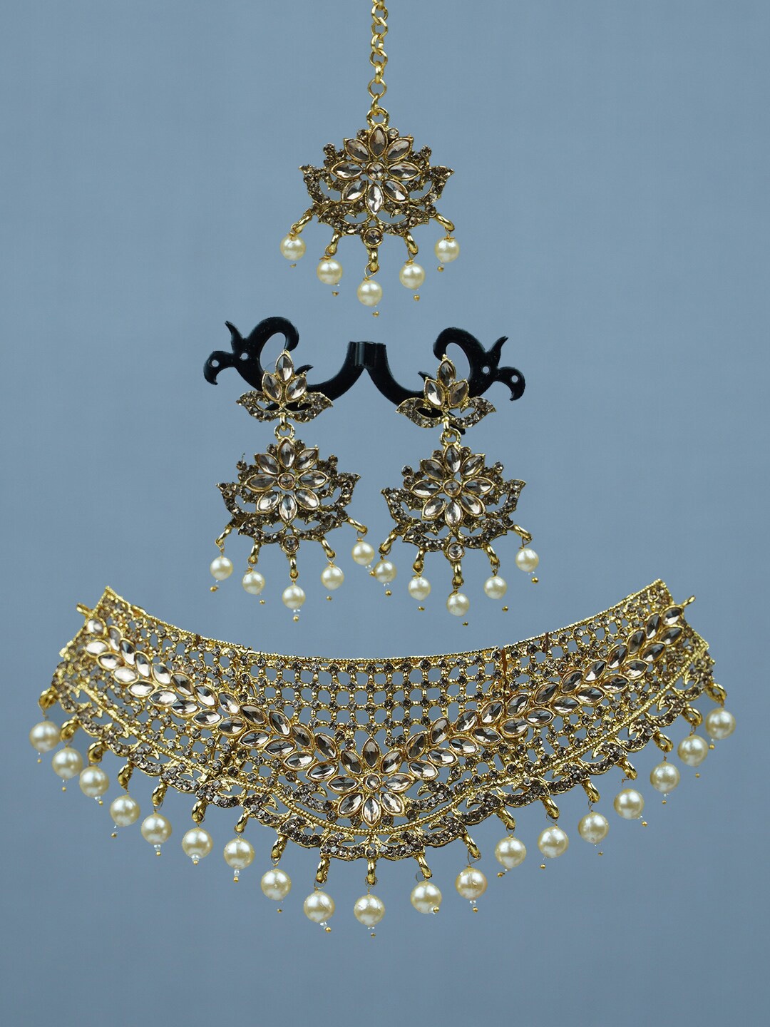 

Diksha collection Gold-Plated Stone-Studded & Beaded Jewellery Set