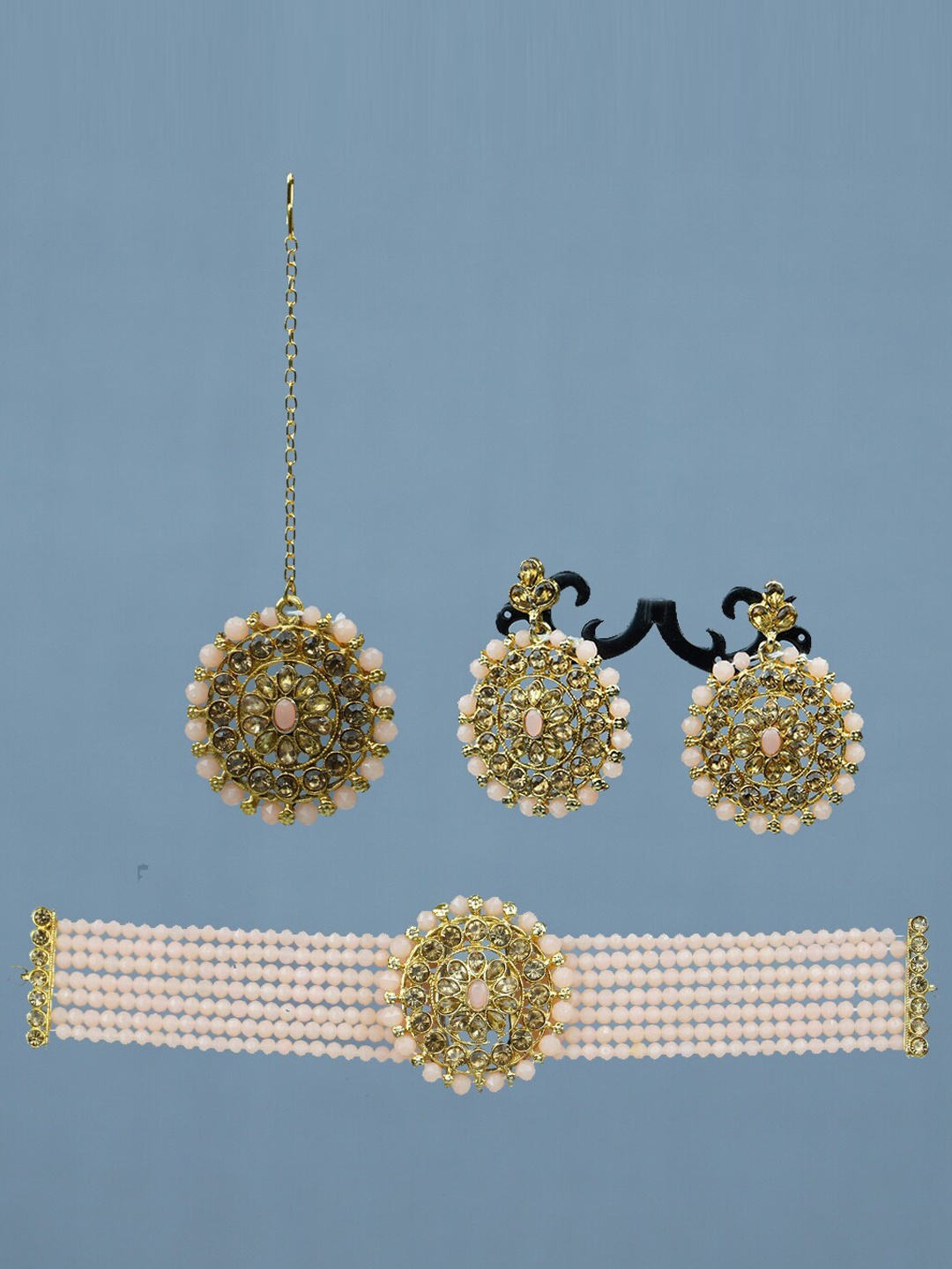 

Diksha collection Gold-Plated Stone-Studded & Beaded Jewellery Set