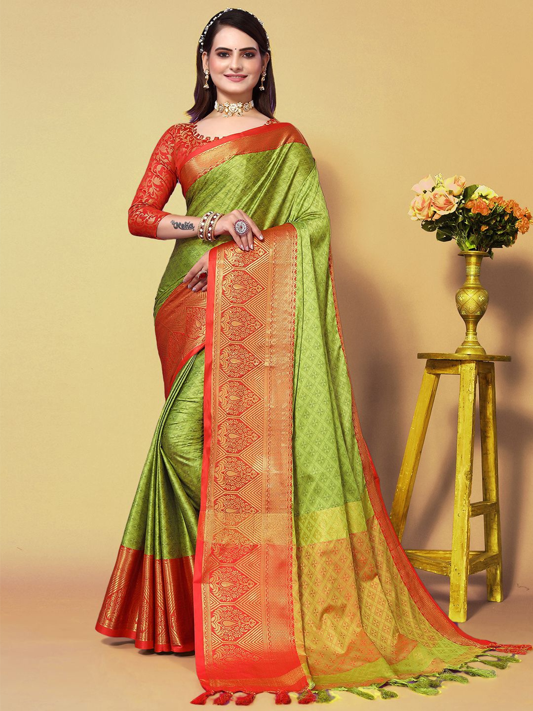 

Mitera Green & Orange Woven Design Zari Saree