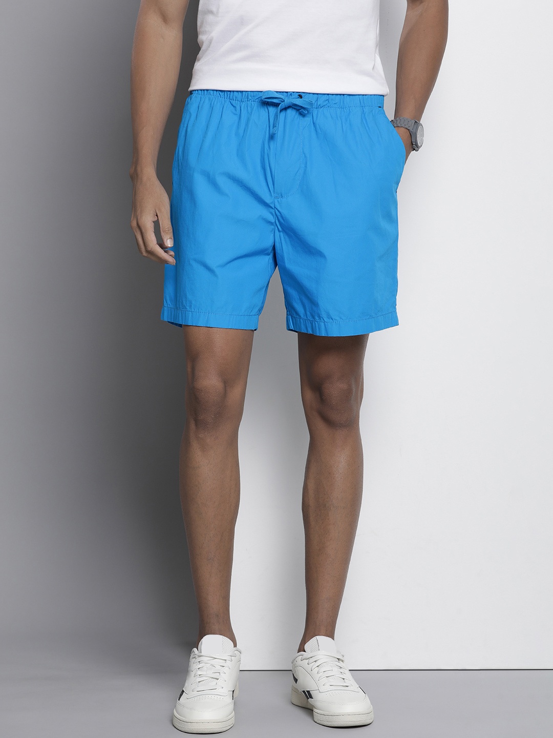 

Tommy Hilfiger Men Pure Cotton Solid Mid-Rise Shorts, Blue