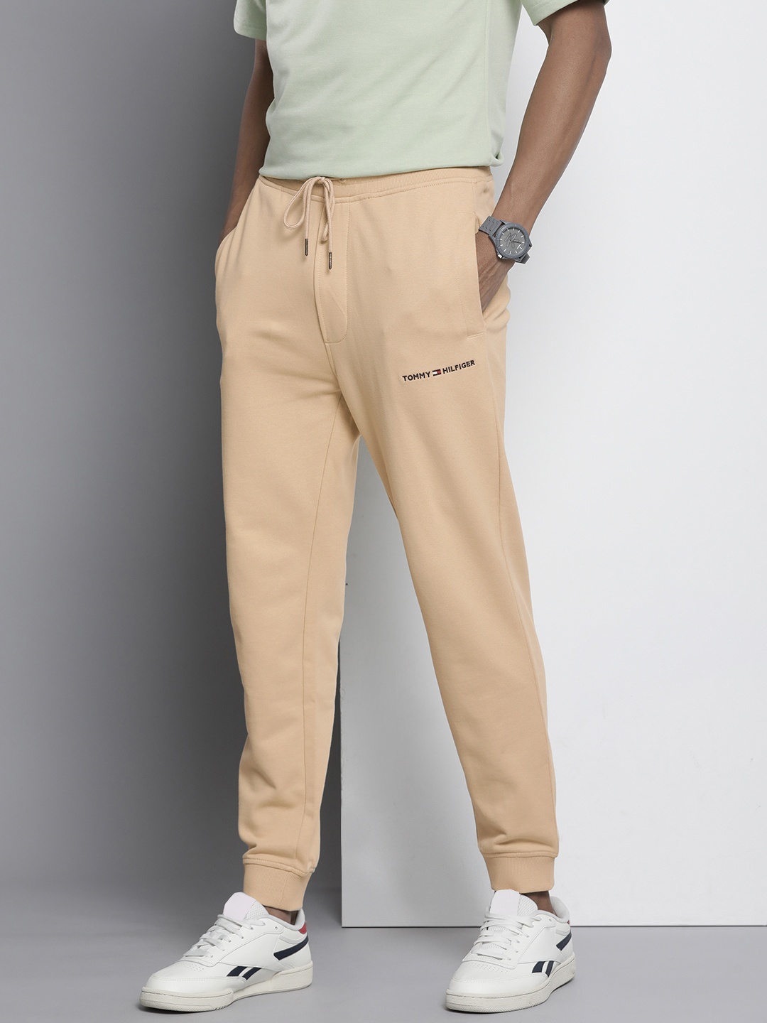 

Tommy Hilfiger Men Pure Cotton Solid Mid-Rise Joggers, Beige