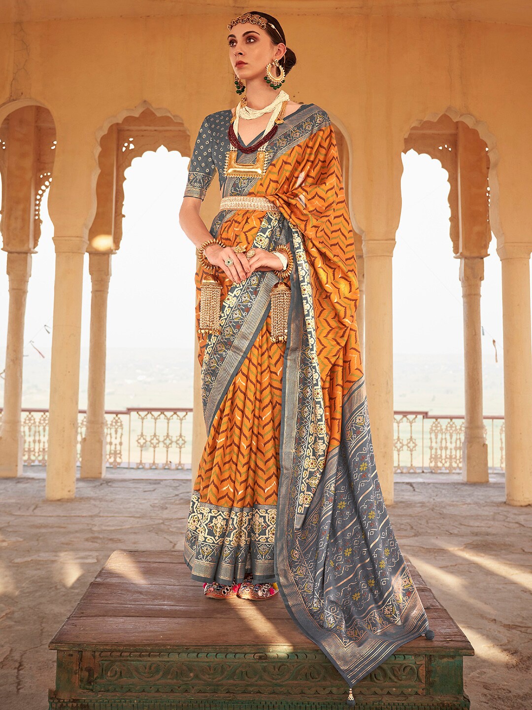 

Anouk Mustard & Grey Ethnic Woven Design Zari Patola Saree